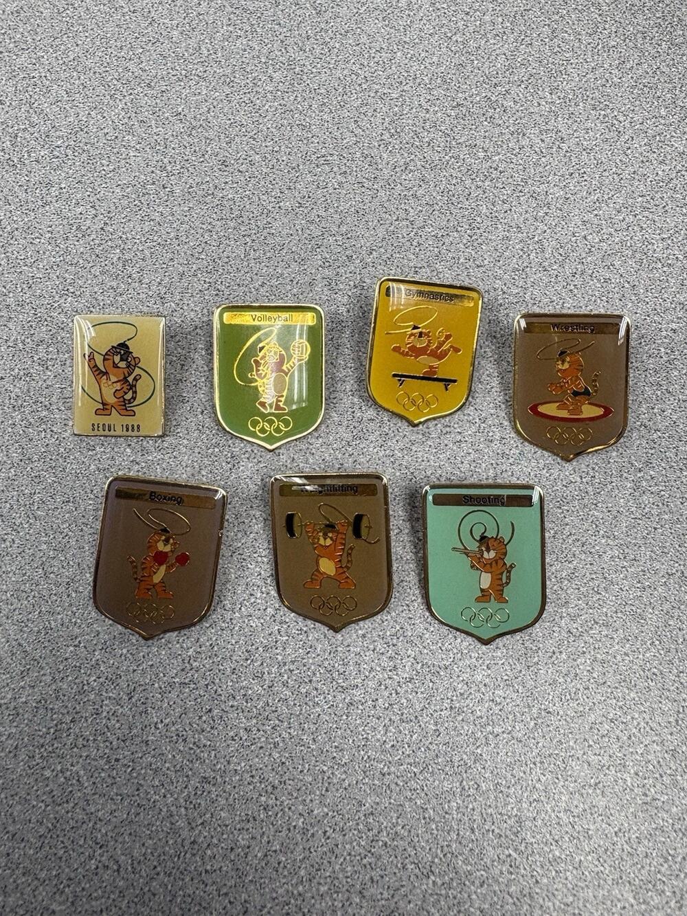 Lot of 7 Hodori the Tiger (Seoul Mascot) Olympic Pins 1983, Boxing/Gymnastics +